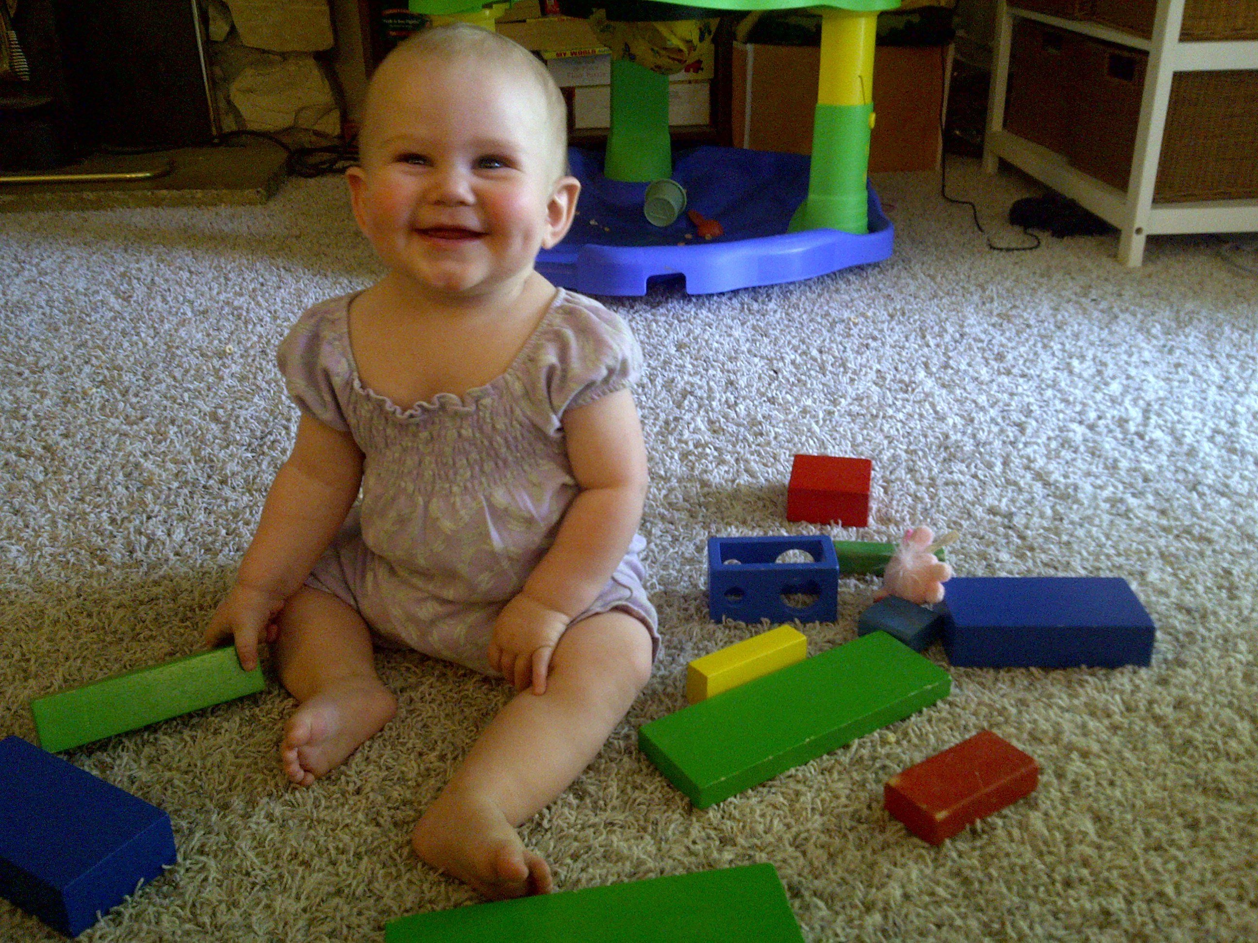 not making the milk sign, but still damn cute playing with blocks